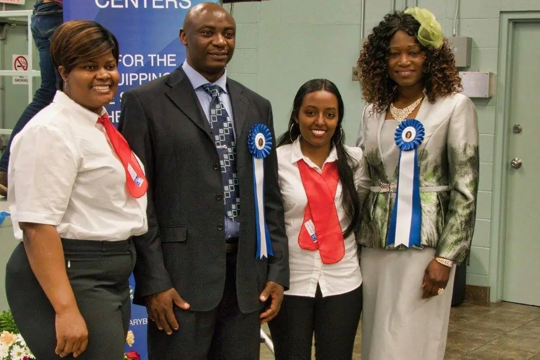 Graduates wearing ribbons at a Canadian Bible Training Centres graduation in Calgary